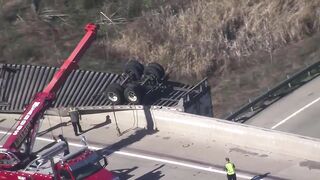 Tractor-trailer dangles from overpass in Pennsylvania