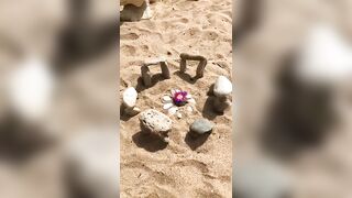 Stacking stones on beach