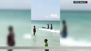 Three words a crowd of Florida beach goers didn’t expect to hear during their Sunday in the sun…...