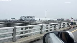 Coast Guard searches for 1 person after tractor-trailer drives off Chesapeake Bay Bridge-Tunnel