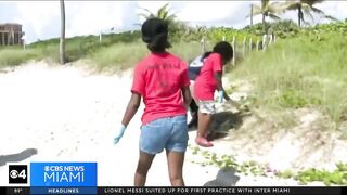 Summercampers and Miramar police participate in beach clean-up