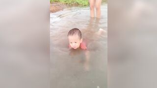 The whole family goes to the stream to cool off in the summer