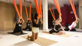 Stretching with yoga hammock on the floor | Fly yoga class