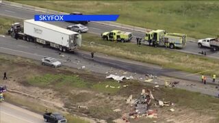 Semi-truck crosses E-470 median, crashes into trailer