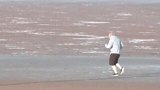 Boris running on Blackpool beach with added Baywatch theme.