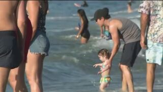 Bay Area beach goers soak up the sun