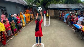 Funny challenge of throwing ball. Village Women winning useful Rewards