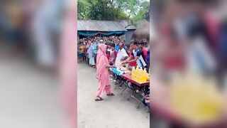 Funny challenge of throwing ball. Village Women winning useful Rewards