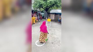 Funny challenge of throwing ball. Village Women winning useful Rewards