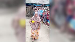 Funny challenge of throwing ball. Village Women winning useful Rewards