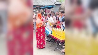 Funny challenge of throwing ball. Village Women winning useful Rewards