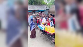 Funny challenge of throwing ball. Village Women winning useful Rewards