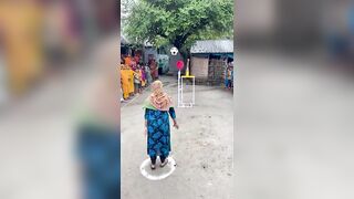 Funny challenge of throwing ball. Village Women winning useful Rewards