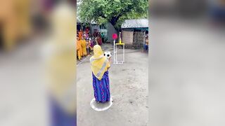 Funny challenge of throwing ball. Village Women winning useful Rewards