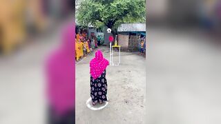 Funny challenge of throwing ball. Village Women winning useful Rewards