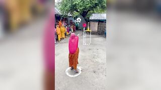 Funny challenge of throwing ball. Village Women winning useful Rewards