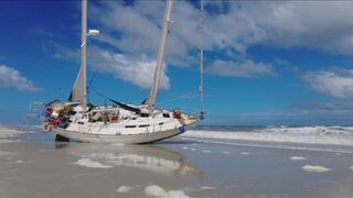 Man with boat stuck on Jacksonville Beach says he was robbed, is having trouble getting tow