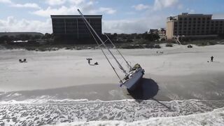 Man with boat stuck on Jacksonville Beach says he was robbed, is having trouble getting tow