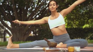 A Flexible Woman Doing Yoga Outdoors