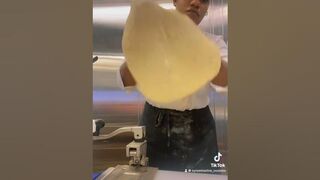 Demonstrating the stretching of pizza dough #pizza #pizzatowergame #pizzalover